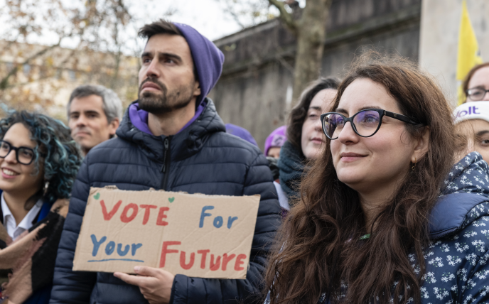 Duarte Costa, Lead Candidate for the European elections in Portugal in 2024, holds a sign with the text 