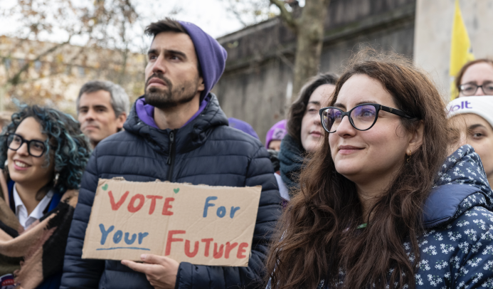 Duarte Costa, Lead Candidate for the European elections in Portugal in 2024, holds a sign with the text 