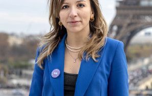 Francesca Romana D'Antuono, Co-President of Volt Europa, smiles in front of the Tour Eiffel