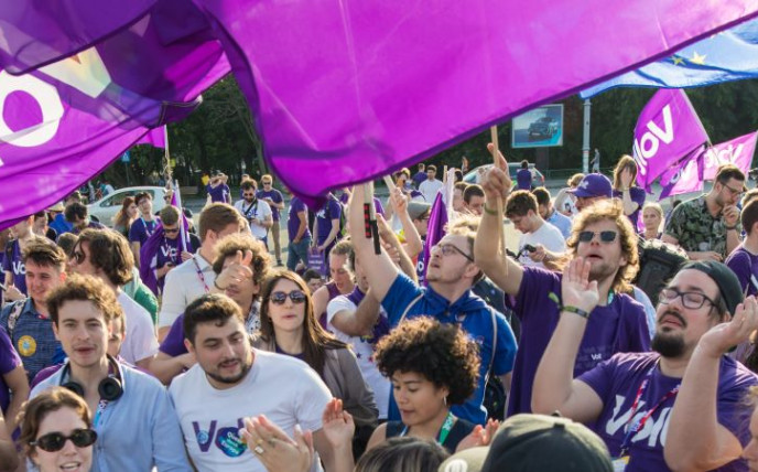 Volters celebrate holding Volt flags in Bucharest