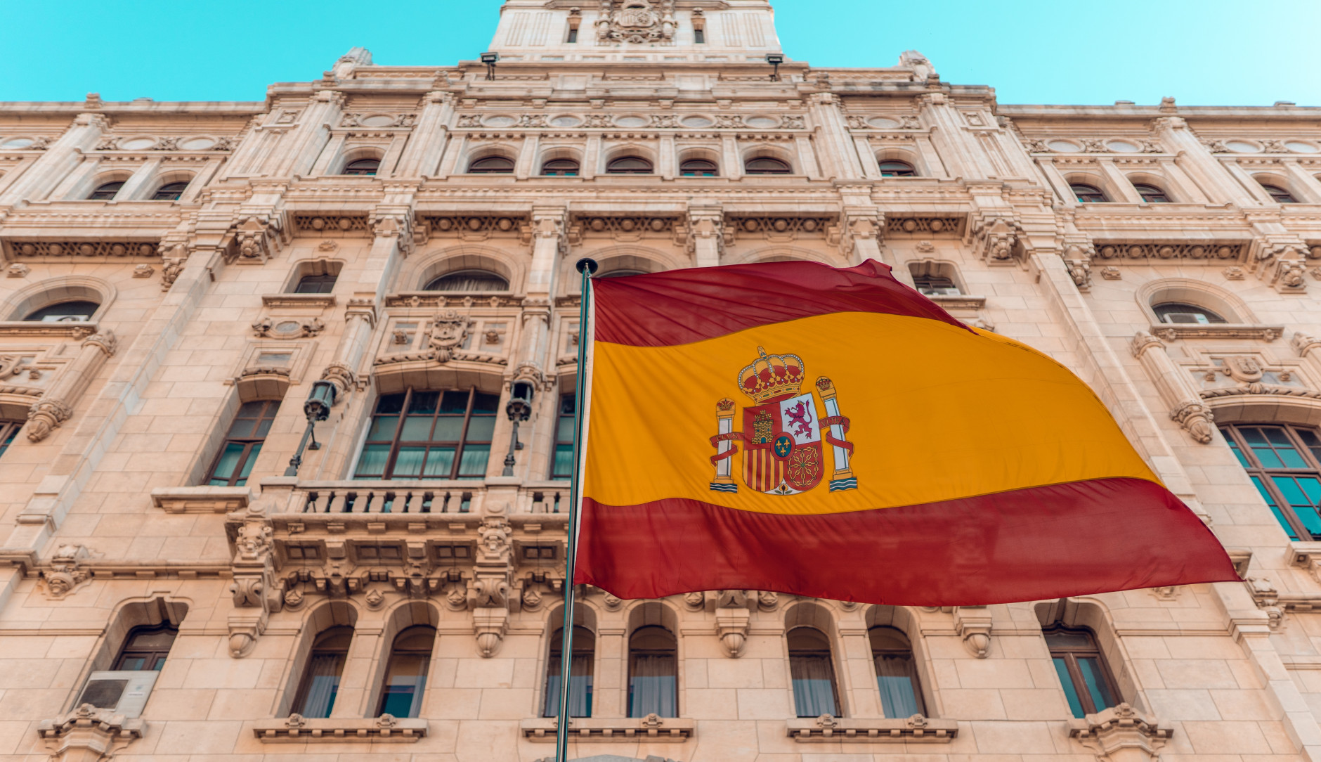 The Spanish flag flying on a building