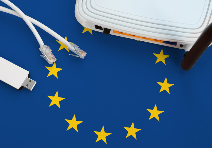 A flag of the European Union with on top of that a router, two ethernet cables, and a dongle.