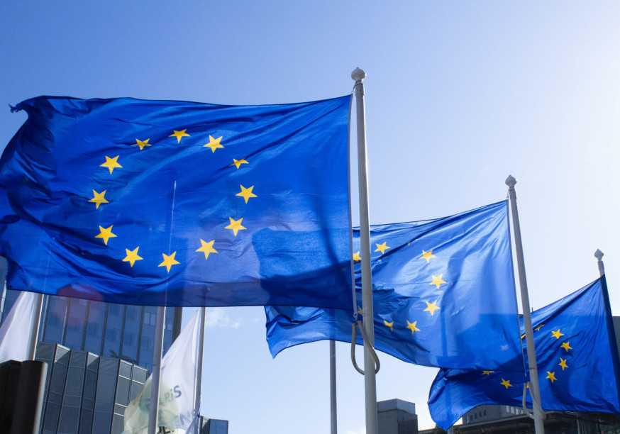 Photograph of 3 EU flags waving in the wind