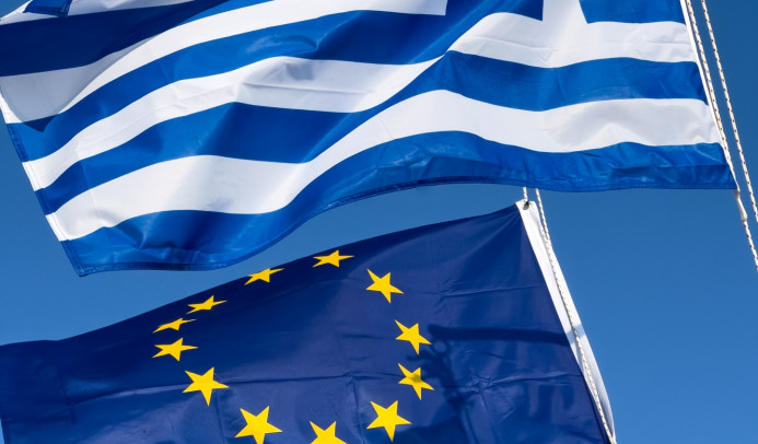 Flags of the EU and of Greece flying next to one another