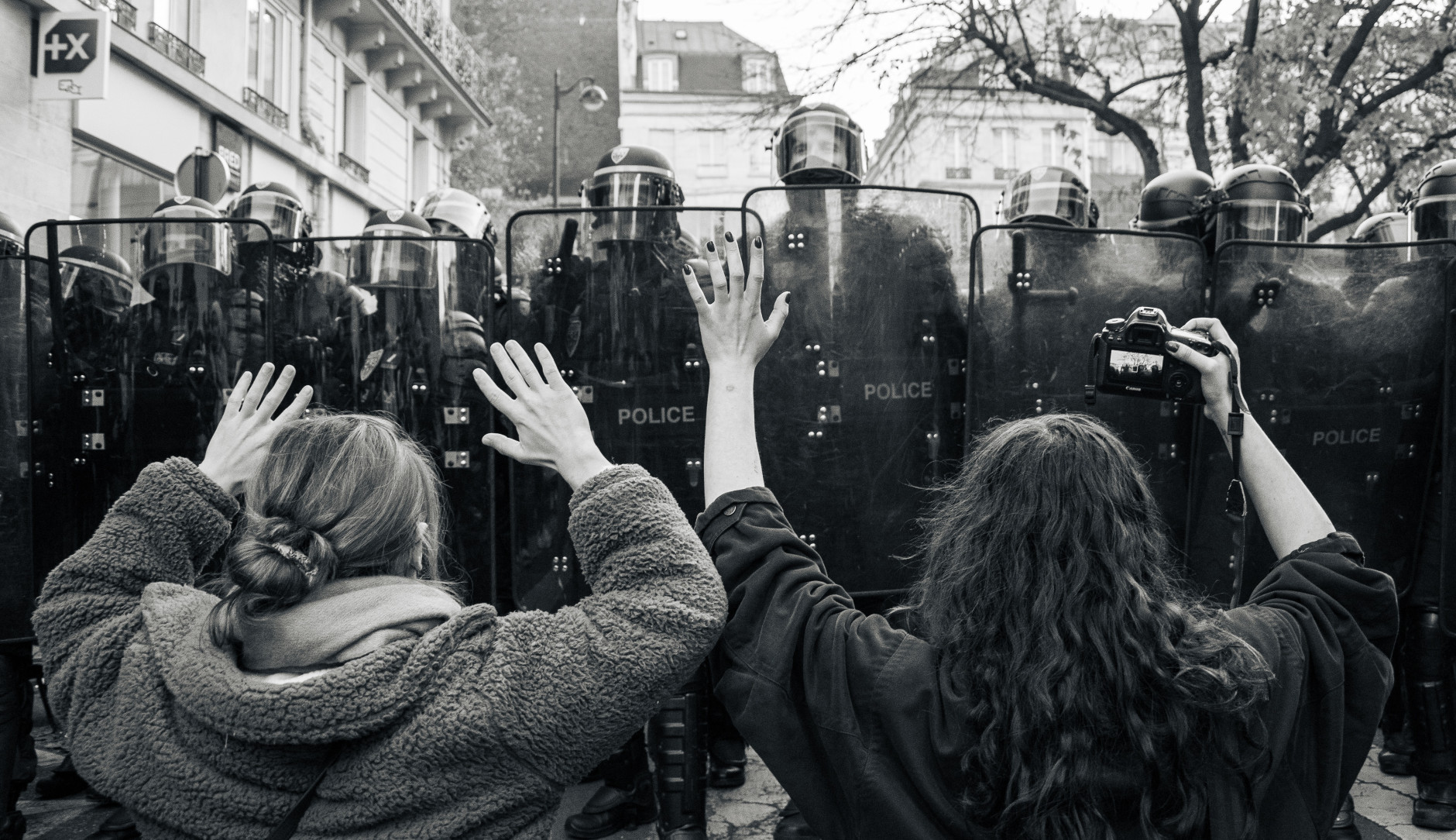 Protestors face riot police