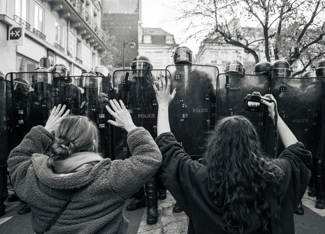 Protestors face riot police