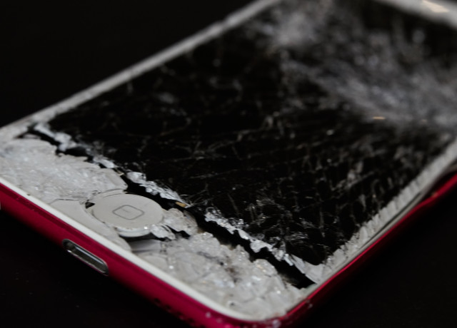 A smartphone with a smashed screen.