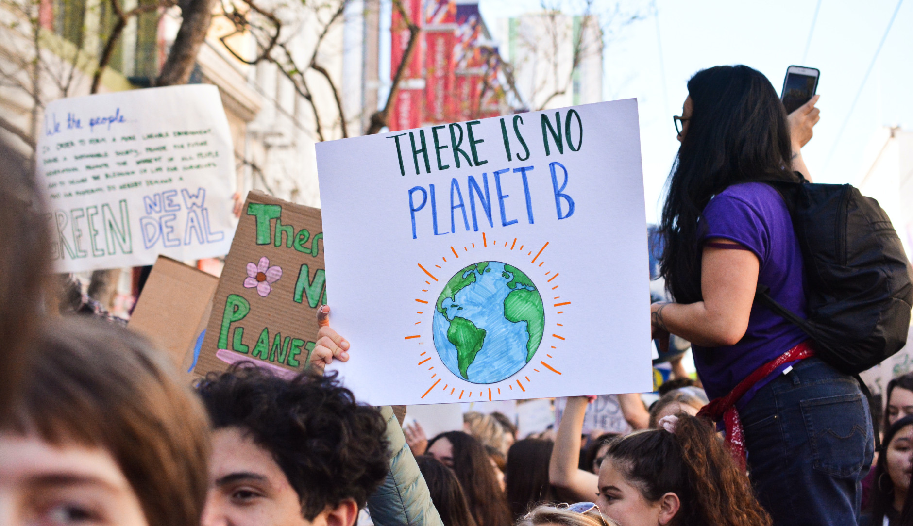 A climate protest. The sign reads, 'There is no planet B'