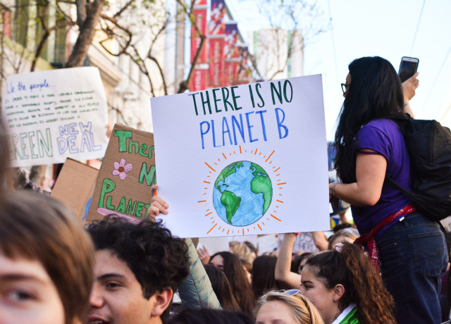 A climate protest. The sign reads, 'There is no planet B'