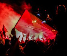 People with a Palestinian flag celebrating at night