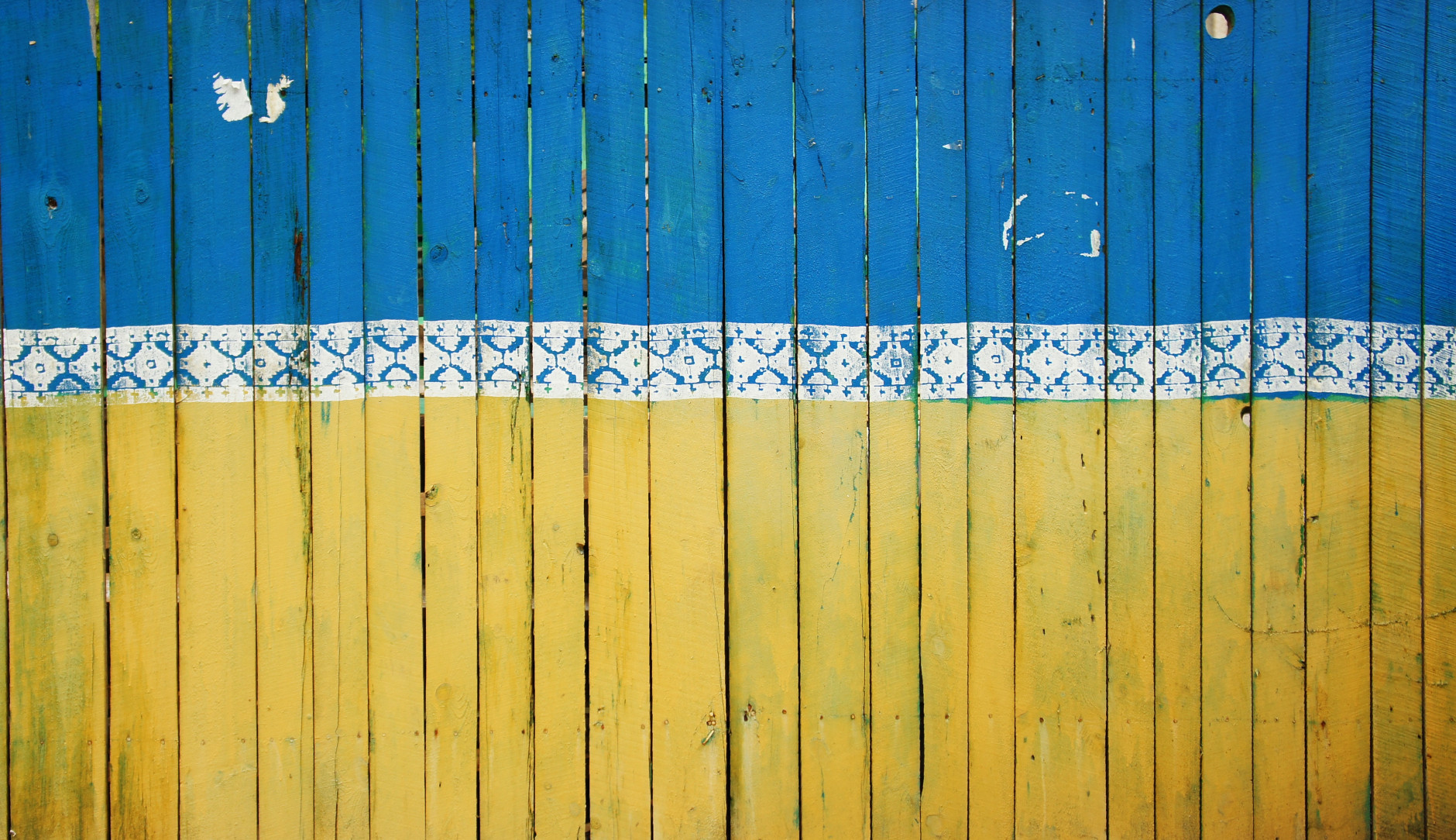 The Ukraine flag painted on a fence