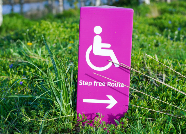 A sign that reads, 'Step free Route', with a symbol of a person in a wheelchair.